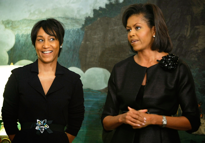 First lady Michelle Obama (right) speaks to female leaders as then-White House Social Secretary Desiree Rogers looks on in the Diplomatic Room of the White House on March 19, 2009, in Washington, D.C. Alex Wong/Getty Images